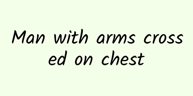 Man with arms crossed on chest