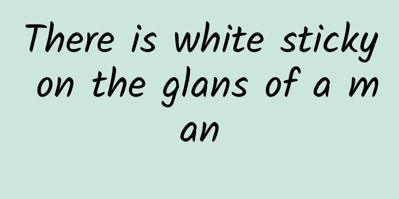 There is white sticky on the glans of a man