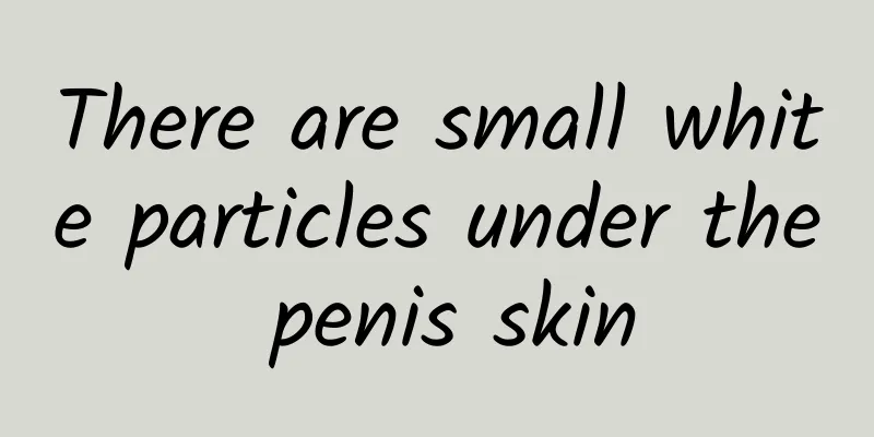There are small white particles under the penis skin