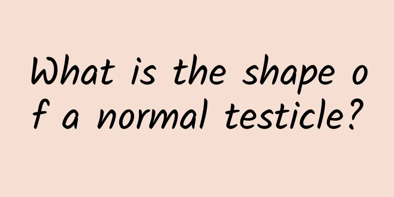 What is the shape of a normal testicle?