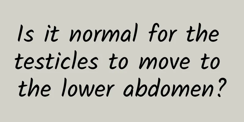 Is it normal for the testicles to move to the lower abdomen?