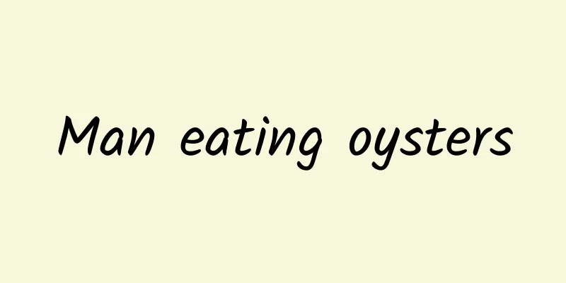 Man eating oysters