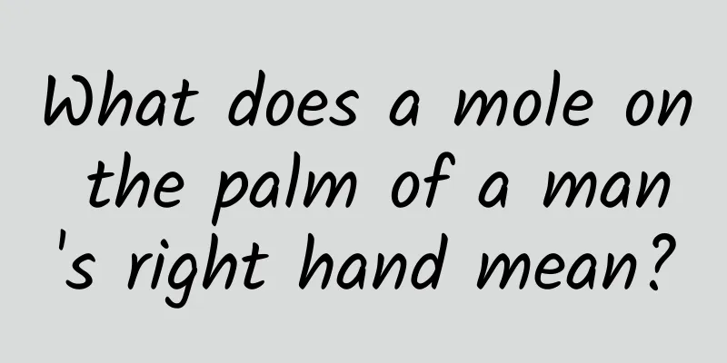 What does a mole on the palm of a man's right hand mean?