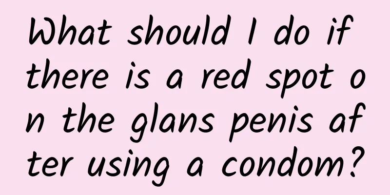 What should I do if there is a red spot on the glans penis after using a condom?