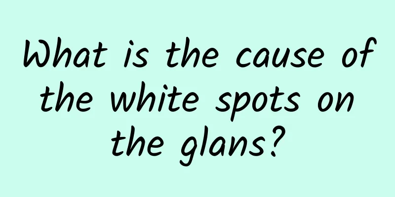 What is the cause of the white spots on the glans?