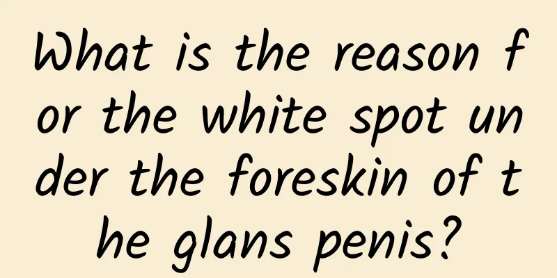 What is the reason for the white spot under the foreskin of the glans penis?