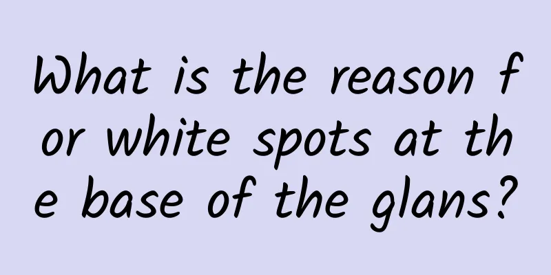 What is the reason for white spots at the base of the glans?