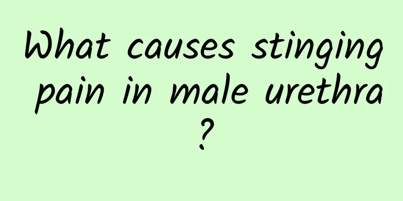 What causes stinging pain in male urethra?