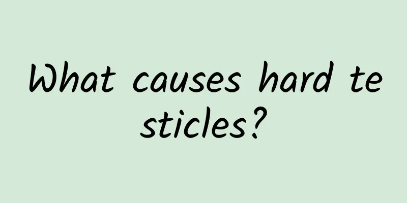 What causes hard testicles?