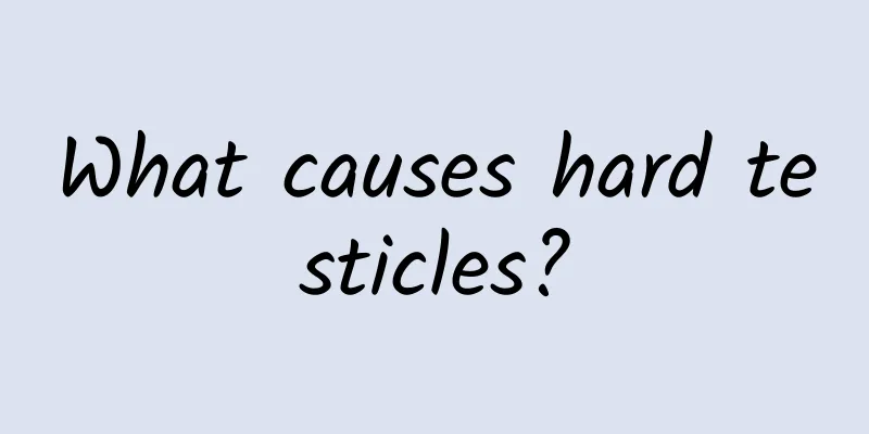 What causes hard testicles?