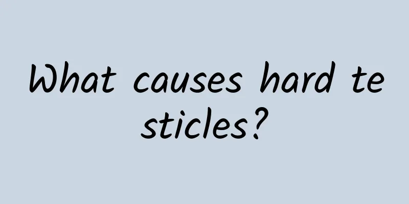 What causes hard testicles?