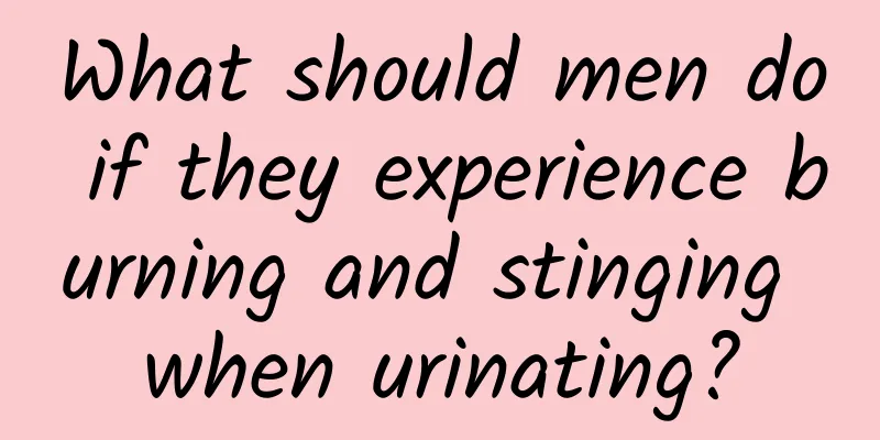 What should men do if they experience burning and stinging when urinating?
