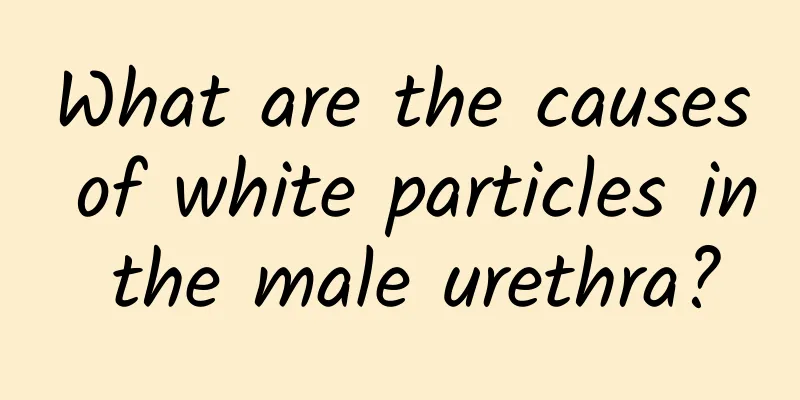 What are the causes of white particles in the male urethra?