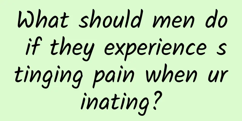 What should men do if they experience stinging pain when urinating?