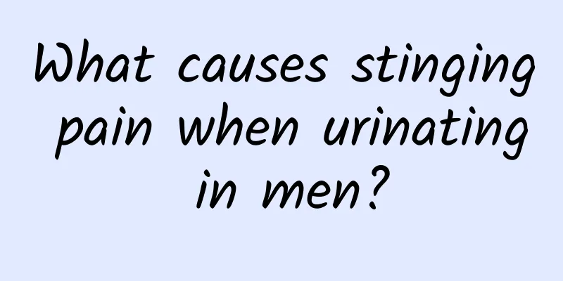 What causes stinging pain when urinating in men?