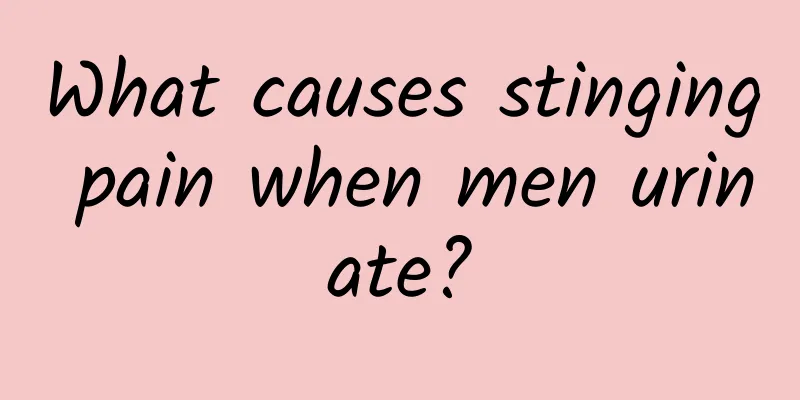 What causes stinging pain when men urinate?