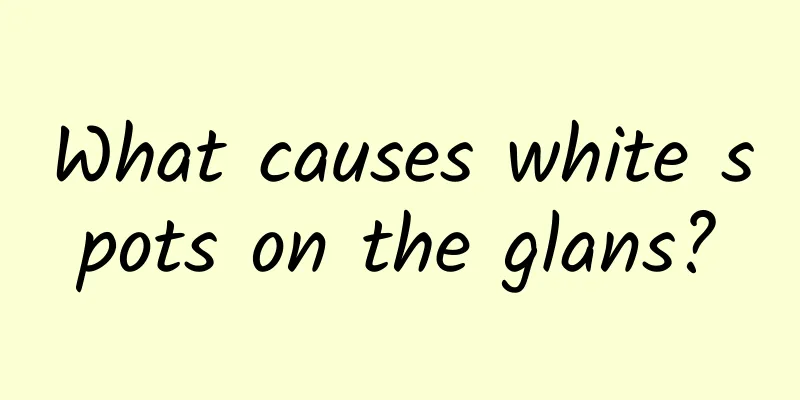 What causes white spots on the glans?